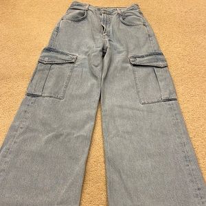 A Golde. Minka style. Size 25. Wide leg. Side cargo type pockets on each leg.